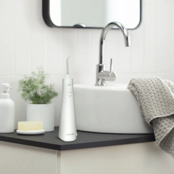 Ирригатор Waterpik WF-21 портатив. импульсн. 2насад. белый - купить недорого с доставкой в интернет-магазине