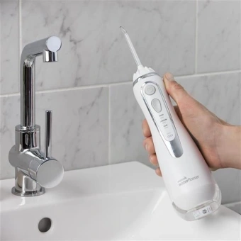 Ирригатор Waterpik WP-560ЕU портатив. импульсн. 4насад. белый - купить недорого с доставкой в интернет-магазине